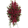 The radiant arrangement includes red roses, red gladioli, red carnations and red