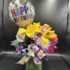 fresh flowers in vase with birthday ribbon 