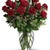 Bouquet of red roses in a clear glass vase