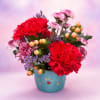 A playful and eye-catching arrangement bursting with rich hot pink carnations, delicate