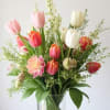 This sweet tulip arrangement embodies spring time and the excitement of new