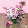 Pink and white floral arrangement in a glass vase