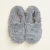 Pair of gray fuzzy slippers on a light background