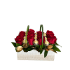 Red roses and gold-wrapped chocolates in a white wooden basket