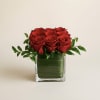 This romantic arrangement showcases nine premium red roses, artfully styled with lush
