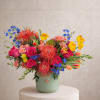 A bold and vibrant arrangement designed with bright, eye-catching colors and rich