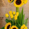 Bright sunflower and yellow rose arrangement in San Antonio by Snyder Flowers