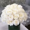 White rose bouquet in a dark green vase