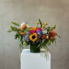 Bright, garden-fresh color greets the recipient with this Farm Fresh flower arrangement