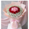 Celebrate with a luxurious bouquet of red and pink roses, elegantly accented