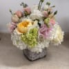 pastel colors, with pink Lisianthus , and pink spray roses, lavender stock