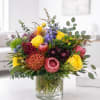This textural arrangement comes complete with pin-cushions proteas, queen proteas, roses, stock