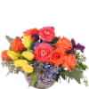 This vibrant floral arrangement is a high-energy mix of bright spring colors