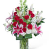 Vivid red roses paired with pink-and-white lilies create a classic romantic statement