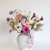 A luxurious garden-style arrangement featuring lush peonies, premium garden roses, elegant calla