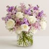 This pastel arrangement creates a graceful and airy display, featuring a charming