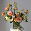 Designed in our signature style: a lush garden-style mix of seasonal blooms