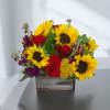 Sunflower and red rose arrangement in a wooden box