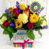 Colorful birthday flower arrangement in a decorated gift box