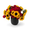Bold and captivating, Sunset Radiance pairs golden sunflowers with lush red roses