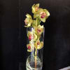 A tall, modern display of yellow cymbidium orchids makes a striking anniversary