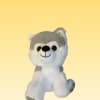 Gray and white plush husky toy on a plain yellow background