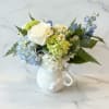This arrangement reminds us an idyllic summer afternoon - a pitcher of