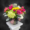 Bright, cheerful and full of springtime charm, this flower arrangement is a