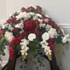 This is a silk arrangement, a dramatic contrast of brilliant red and