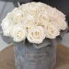 White rose bouquet in a gray hatbox