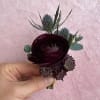All of our boutonnieres include multiple blooms with touches of greenery. Each