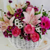 A soft and elegant floral basket designed to make a lasting impression.