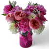 Beautiful bouquet arranged with roses daisies hydrangeas and more in a tall