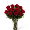 Bouquet of red roses in a clear glass vase