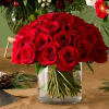 Red rose bouquet in a clear glass vase