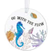 Round hanging ornament with a seahorse and the words Go With The Flow