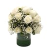 An arrangement of elegant white roses surrounded by baby&rsquo;s breath and lush