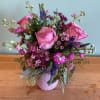 A cluster of soft pink roses takes center stage in this Neat