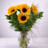 Sunlit sunflowers take center stage in this cheerful flower arrangement-perfect as a