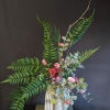 Elevate your d&eacute;cor with this elegant faux bouquet arrangement featuring a soft