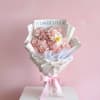 A dreamy arrangement designed in soft blush tones, featuring delicate carnations paired