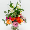 Mixed bouquet of roses and lilies in a glass vase