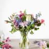 tulips, roses, lark/stock, queens in a glass vase

*similar substitutions depending on inventory