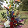 A dramatic vertical display of tropical flair-this tall flower arrangement pairs bold