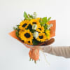 Bursting with bright sunflowers, this cheerful flower arrangement is a sunny pick-me-up