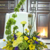  Sunlit Grace is a bright, garden-style arrangement designed with height, movement