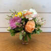 Apricot roses and a large lavender chrysanthemum with white daisies, yellow button