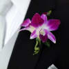 Simple orchid boutonniere that will add class to any suit.