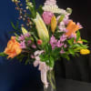 A tall, joyful event bouquet that reads like a celebration in bloom-perfect