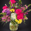 This Colorful Rose and Hydrangea Vase Arrangement features hot pink roses, blue